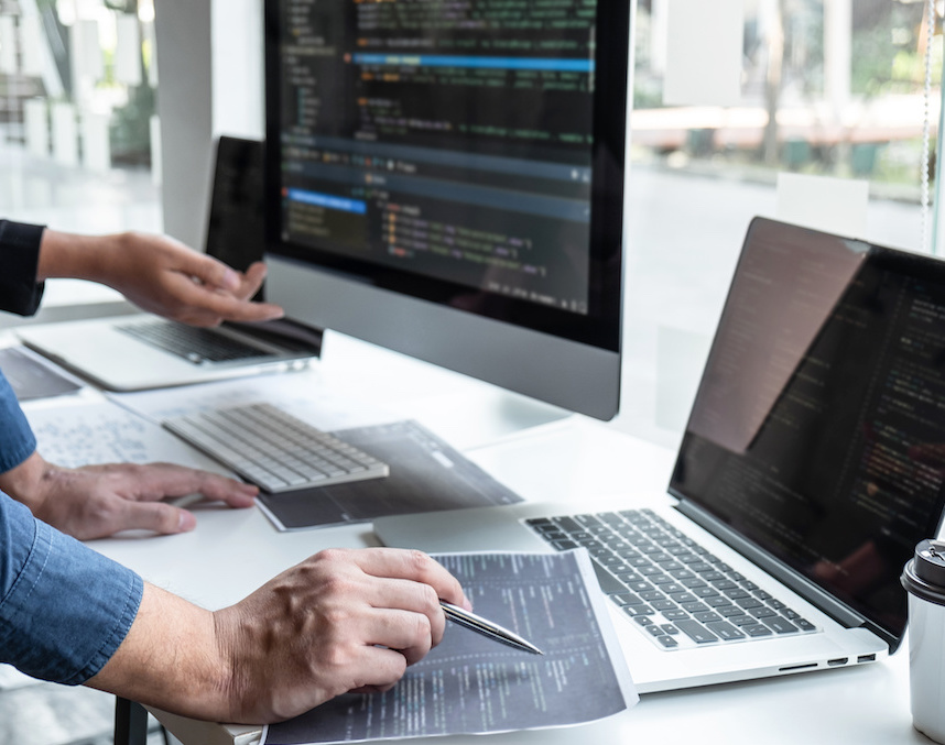 Team of developer programmer working on project in software development computer in IT company office, Writing codes and data code website and coding database technologies to find problem solution